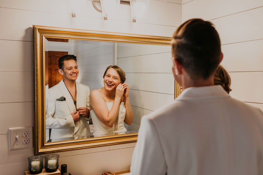 LGBTQ+ couple getting ready together before their wedding.