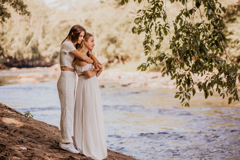 Couple embracing near the river.