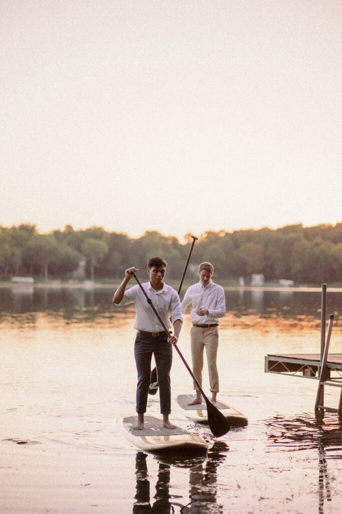 Adventure elopement activities: A couple paddleboarding.